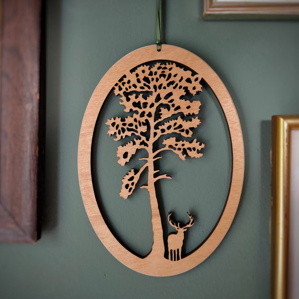 Wooden Hanging of a Stag under Scots Pine Tree