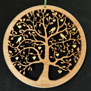 Wooden wall hanging of a tree with hearts and birds in the branches