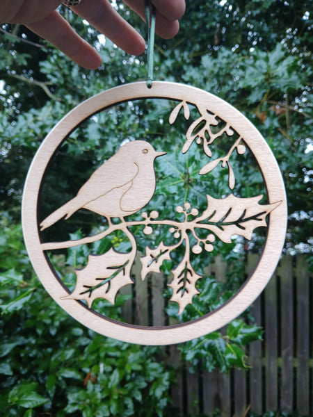 Wooden hanging of a Robin amongst Holly and Mistletoe
