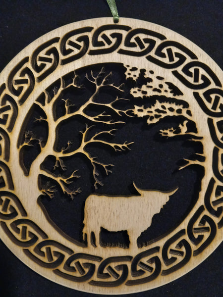 Hanging of Highland Cow under Trees with Celtic Knot border
