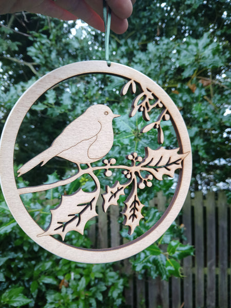 Wooden hanging of a Robin amongst Holly and Mistletoe