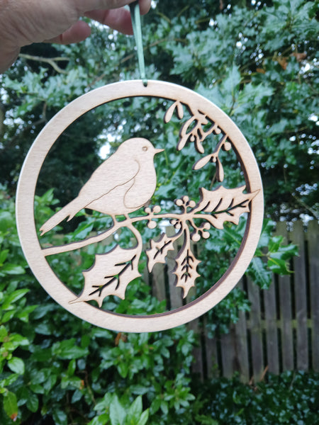 Wooden hanging of a Robin amongst Holly and Mistletoe