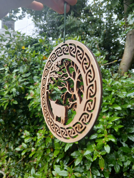 Hanging of Highland Cow under Trees with Celtic Knot border