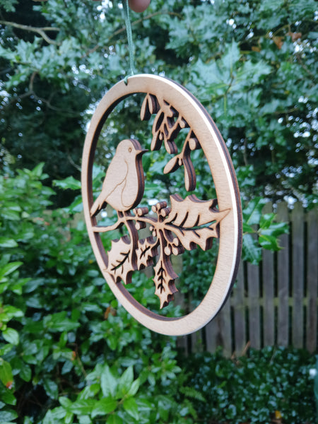 Wooden hanging of a Robin amongst Holly and Mistletoe