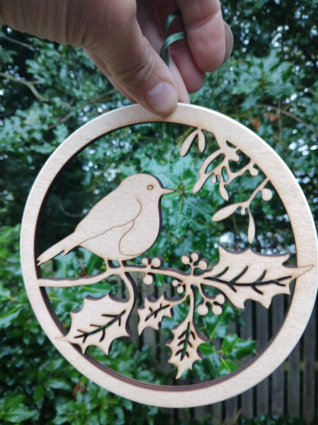 Wooden hanging of a Robin amongst Holly and Mistletoe