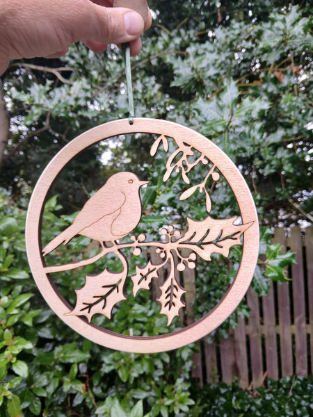 Wooden hanging of a Robin amongst Holly and Mistletoe