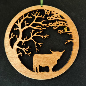 Wooden Hanging of Highland Cow under Trees