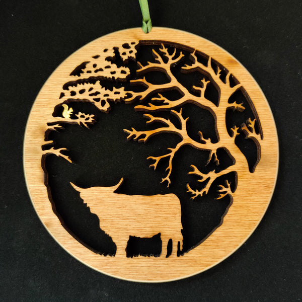 Wooden Hanging of Highland Cow under Trees